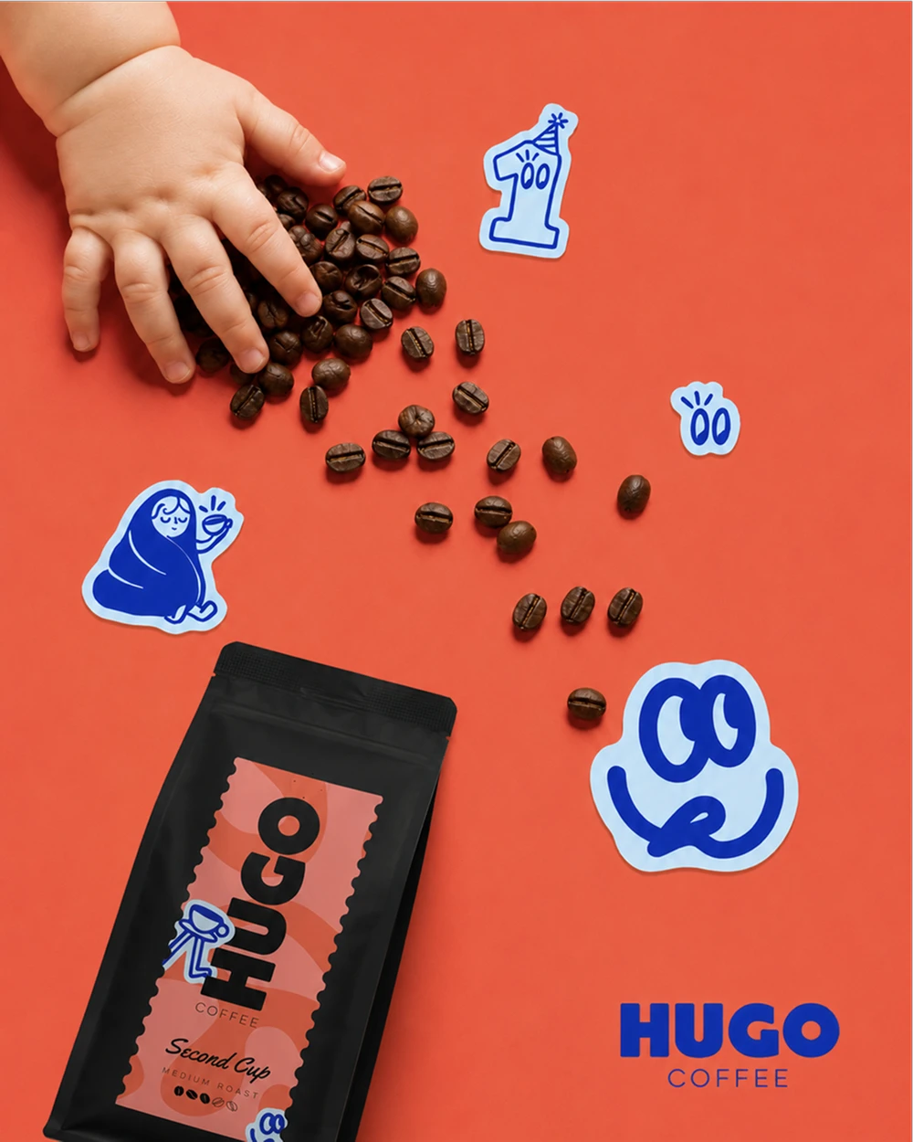 Coffee beans and a Hugo bag with blue stickers
