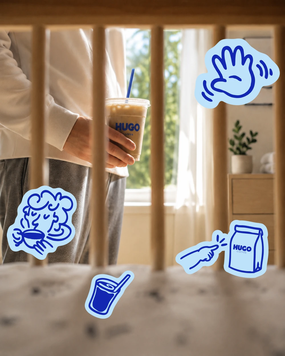 Iced coffee by the window with Hugo stickers